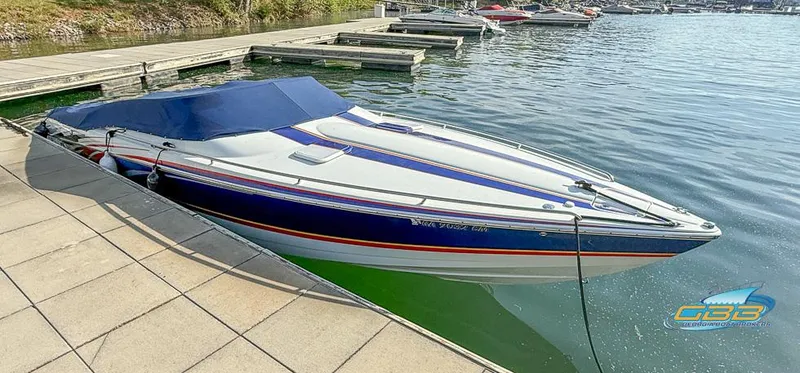 Slide: The Image of 2008 Formula 292 FASTech speedboat docked at a marina, featuring sleek design and vibrant colors. - 10