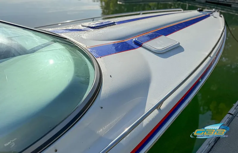 Slide: The Image of 2008 Formula 292 FASTech boat with sleek design and vibrant blue and orange accents. - 11