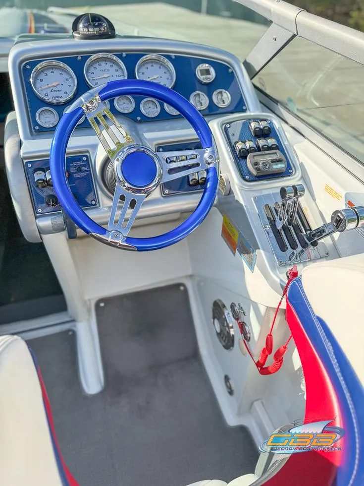 Slide: The Image of 2008 Formula 292 FASTech boat cockpit with blue steering wheel and control panel. - 16