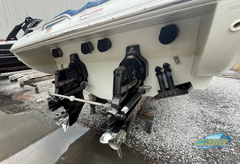 Slide: The Image of 2008 Formula 292 FASTech boat stern with dual propellers on gravel surface. - 24