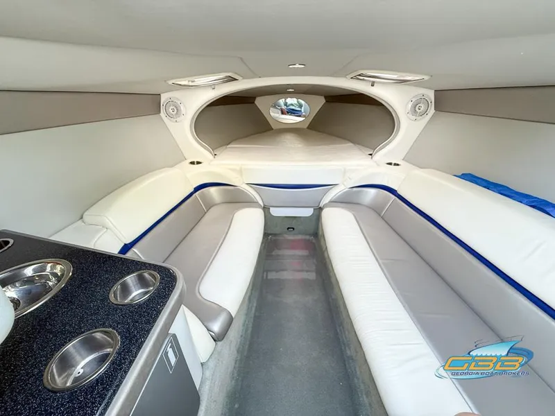 Slide: The Image of 2008 Formula 292 FASTech boat interior with white seating and kitchenette. - 28