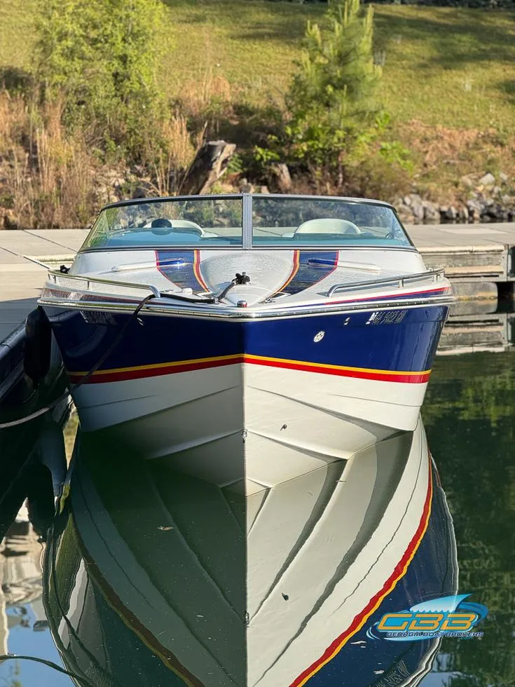 Slide: The Image of 2008 Formula 292 FASTech boat docked on calm water, reflecting its sleek design. - 3