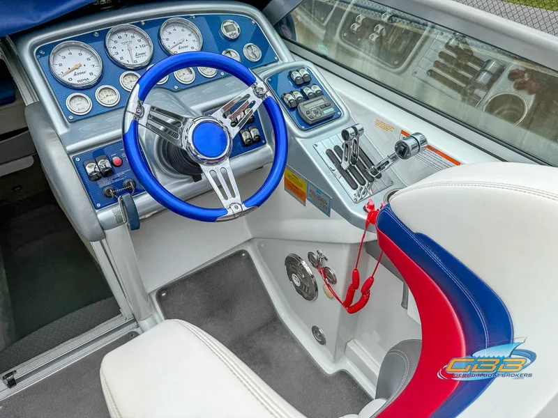 Slide: The Image of 2008 Formula 292 FASTech boat cockpit with blue steering wheel and control panel. - 36