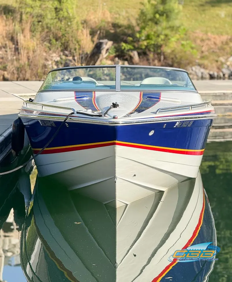 Slide: The Image of 2008 Formula 292 FASTech boat docked on calm water, showcasing sleek design and vibrant colors. - 6