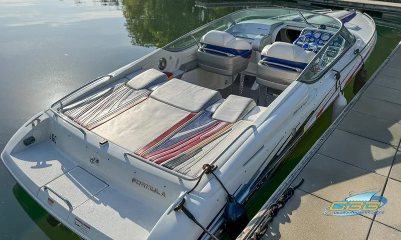 Slide: The Image of 2008 Formula 292 FASTech boat docked, featuring sleek design and comfortable seating. - 8