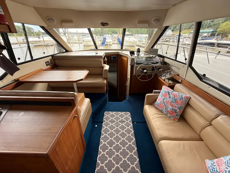 Slide: The Image of Interior of 2000 Bayliner 4087 Aft Cabin Motoryacht with seating and helm. - 13