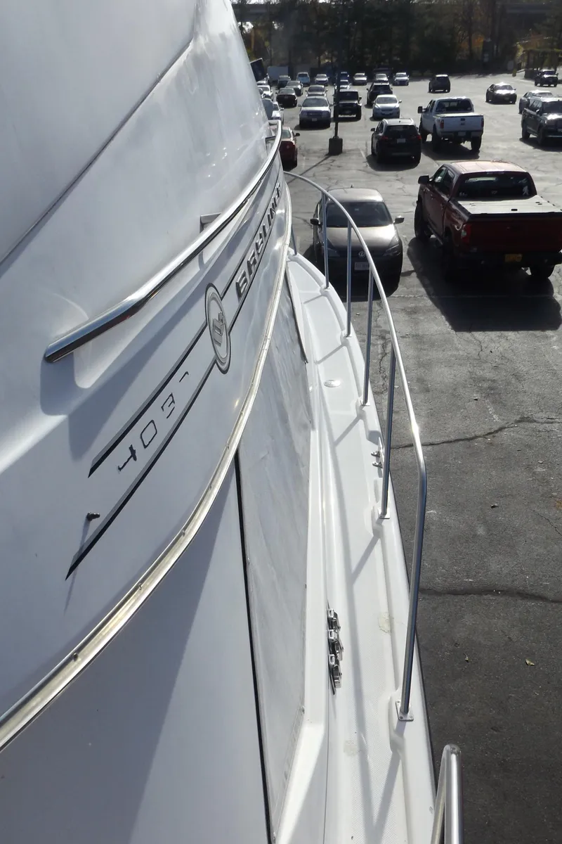 Slide: The Image of 2000 Bayliner 4087 Aft Cabin Motoryacht parked in a busy lot, side view. - 29