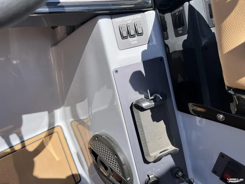 Slide: The Image of 2025 MasterCraft NXT24 boat dashboard with control panel and speaker. - 13