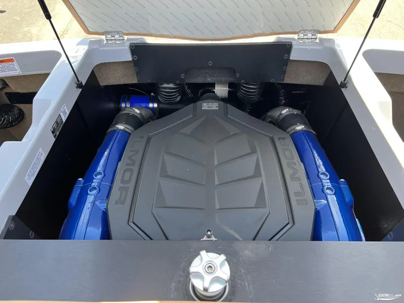 Slide: The Image of 2025 MasterCraft NXT24 engine compartment with Ilmor engine, showcasing blue components. - 16
