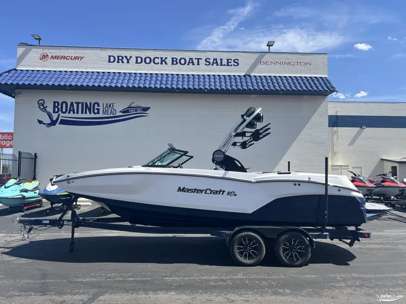 Slide: The Image of 2025 MasterCraft NXT22 boat on trailer at Dry Dock Boat Sales. - 0