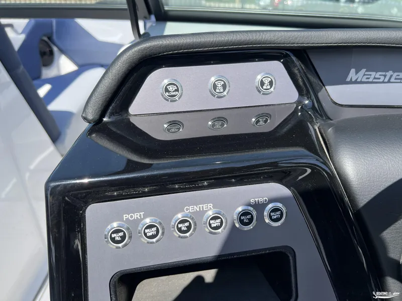 Slide: The Image of Control panel of 2025 MasterCraft NXT22 boat with ballast and blower switches. - 11