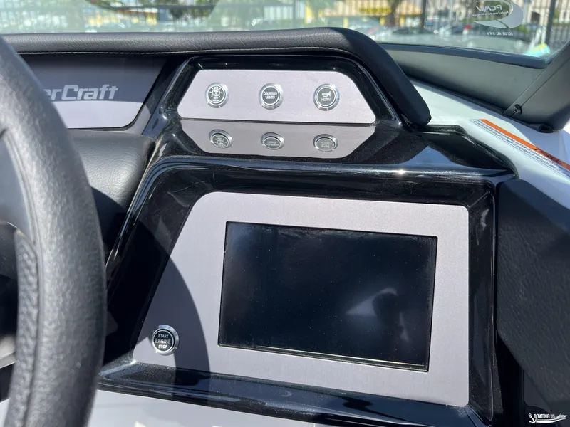 Slide: The Image of Dashboard of 2025 MasterCraft NXT22 boat with touchscreen and control buttons. - 12