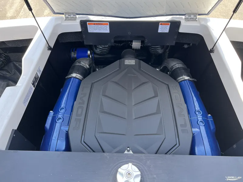 Slide: The Image of 2025 MasterCraft NXT22 engine compartment with Ilmor engine, showcasing blue components. - 16