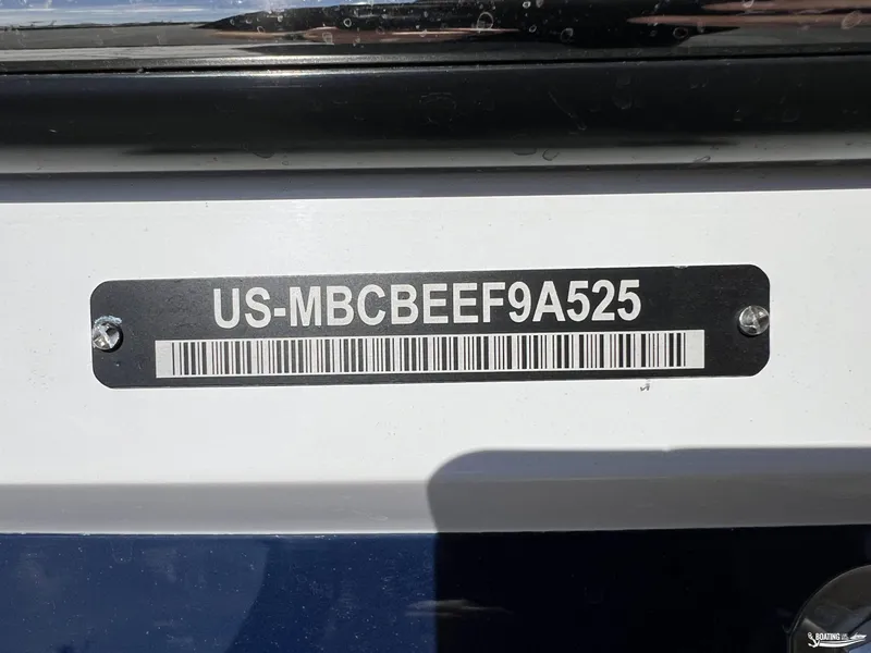 Slide: The Image of 2025 MasterCraft NXT22 boat identification plate with serial number and barcode. - 23