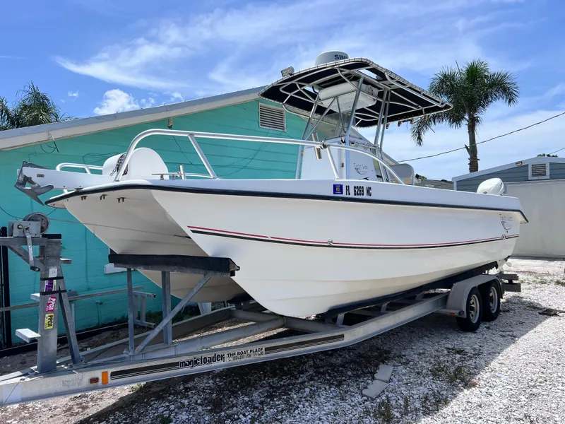 Slide: The Image of Twin Vee 22 Center Console boat on trailer, 2005 model, parked outdoors. - 1
