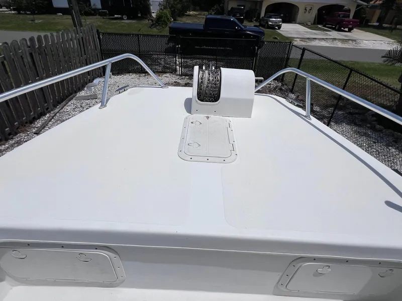 Slide: The Image of Bow view of 2005 Twin Vee 22 Center Console boat, featuring anchor and railings. - 11