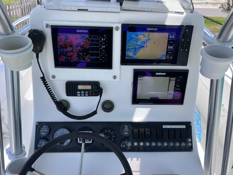 Slide: The Image of Center console of a 2005 Twin Vee 22 Awesome boat with Simrad navigation displays. - 14