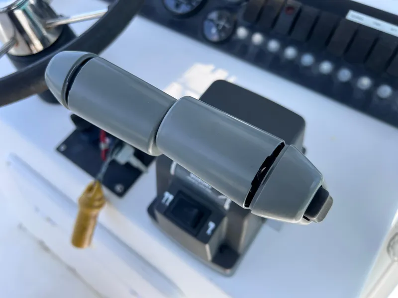 Slide: The Image of Close-up of a Twin Vee 22 Center Console boat throttle control, 2005 model. - 15