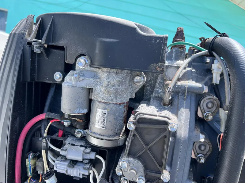 Slide: The Image of Close-up of a 2005 Twin Vee 22 Awesome Center Console engine components. - 16