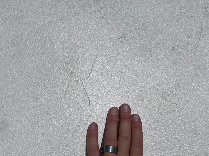 Slide: The Image of Hand touching textured surface of 2005 Twin Vee 22 Center Console boat. - 17