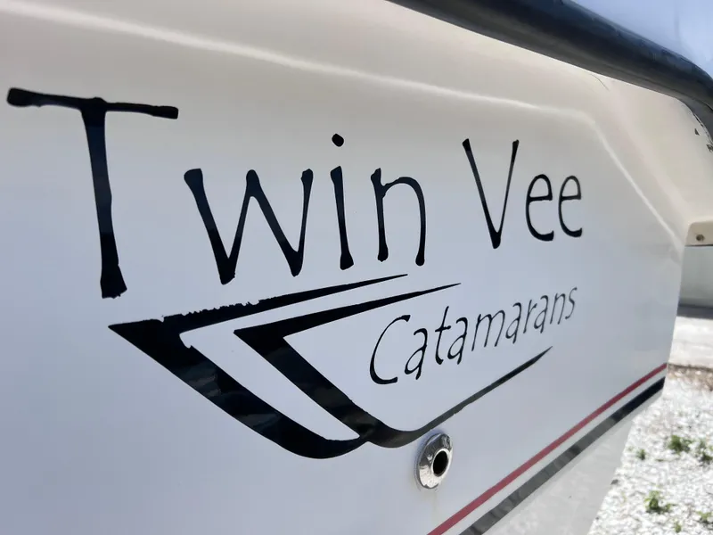 Slide: The Image of Close-up of Twin Vee Catamarans logo on a 2005 model boat. - 2