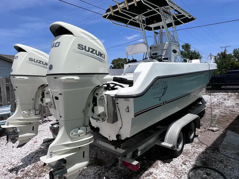 Slide: The Image of Twin Vee 22 Center Console boat with Suzuki 140 engines on a trailer. - 4