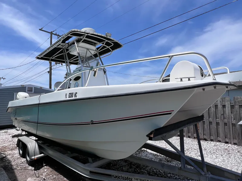 Slide: The Image of Twin Vee 22 Center Console boat on trailer, 2005 model, clear sky background. - 5