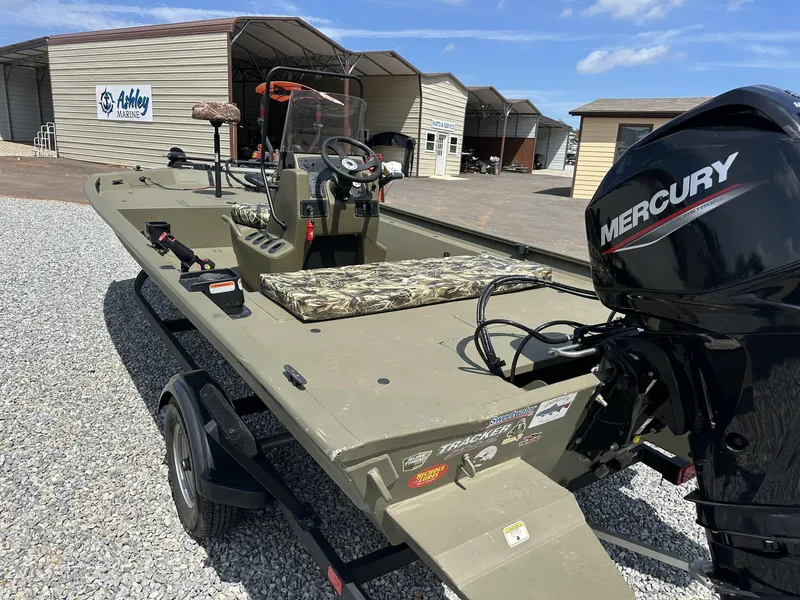 Slide: The Image of 2024 Tracker Grizzly 1860 CC boat with Mercury engine at Ashley Marine dealership. - 11