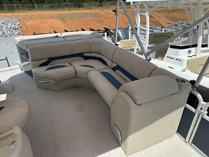 Slide: The Image of Luxurious seating on a 2015 Lowe SS190 boat, featuring beige and blue upholstery. - 3