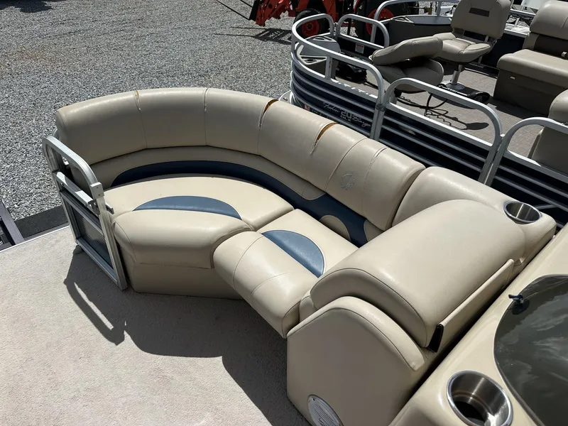 Slide: The Image of 2015 Lowe SS190 pontoon boat with beige seating and cup holders. - 7