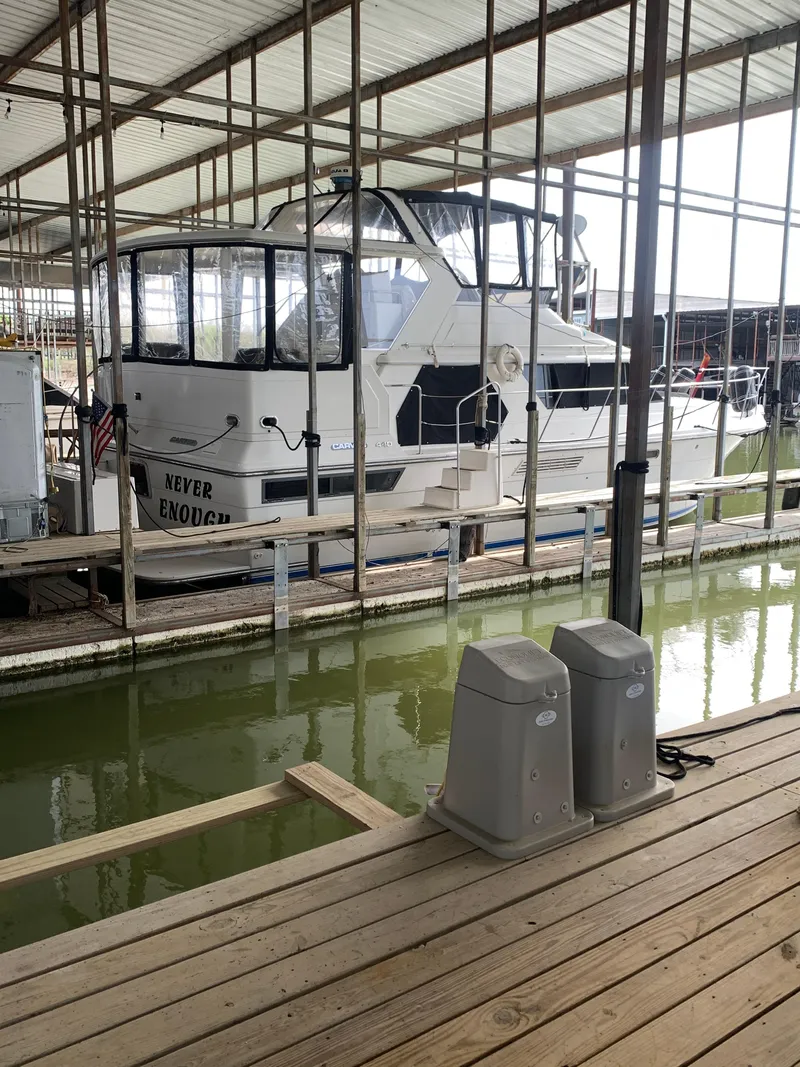 Slide: The Image of 1994 Carver 440 Aft Cabin Motor Yacht docked in a covered marina. - 15