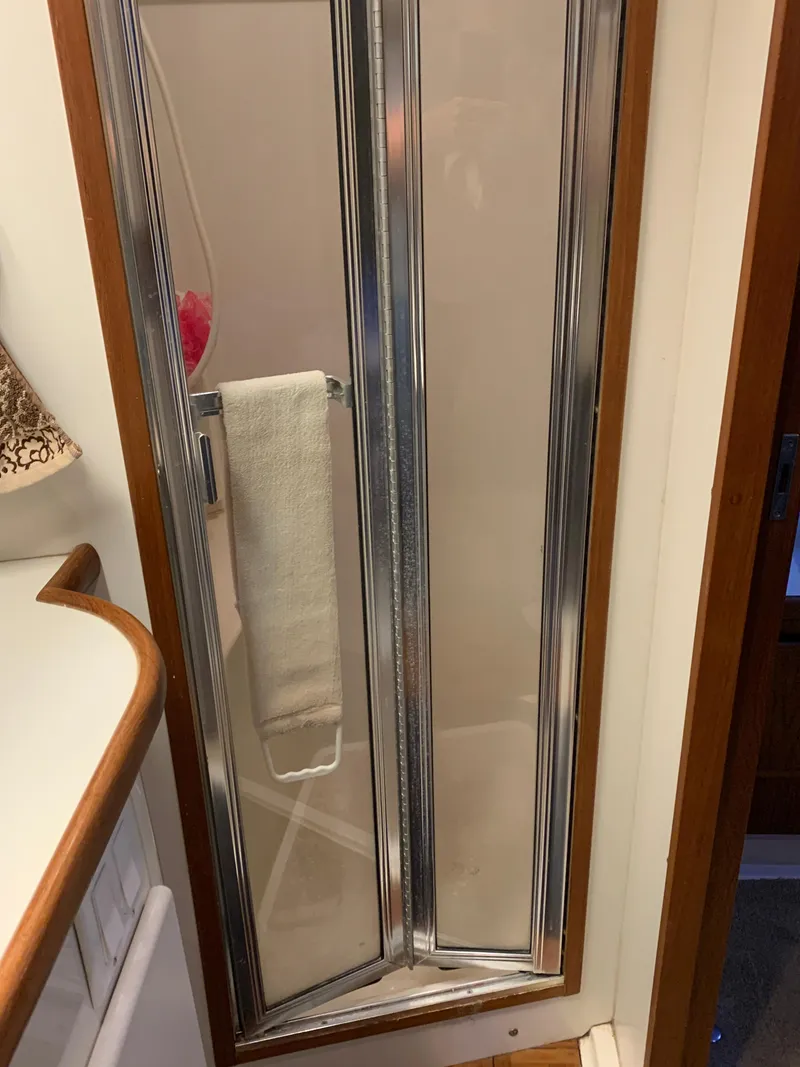 Slide: The Image of Shower door in 1994 Carver 440 Aft Cabin Motor Yacht bathroom. - 26