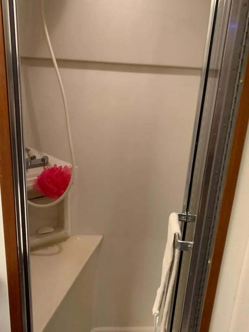 Slide: The Image of Shower area in 1994 Carver 440 Aft Cabin Motor Yacht, featuring a compact design. - 27