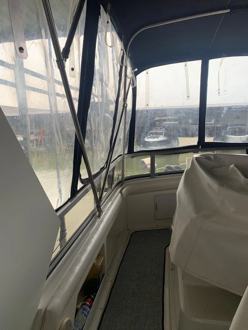 Slide: The Image of 1994 Carver 440 Aft Cabin Motor Yacht docked in a marina. - 1