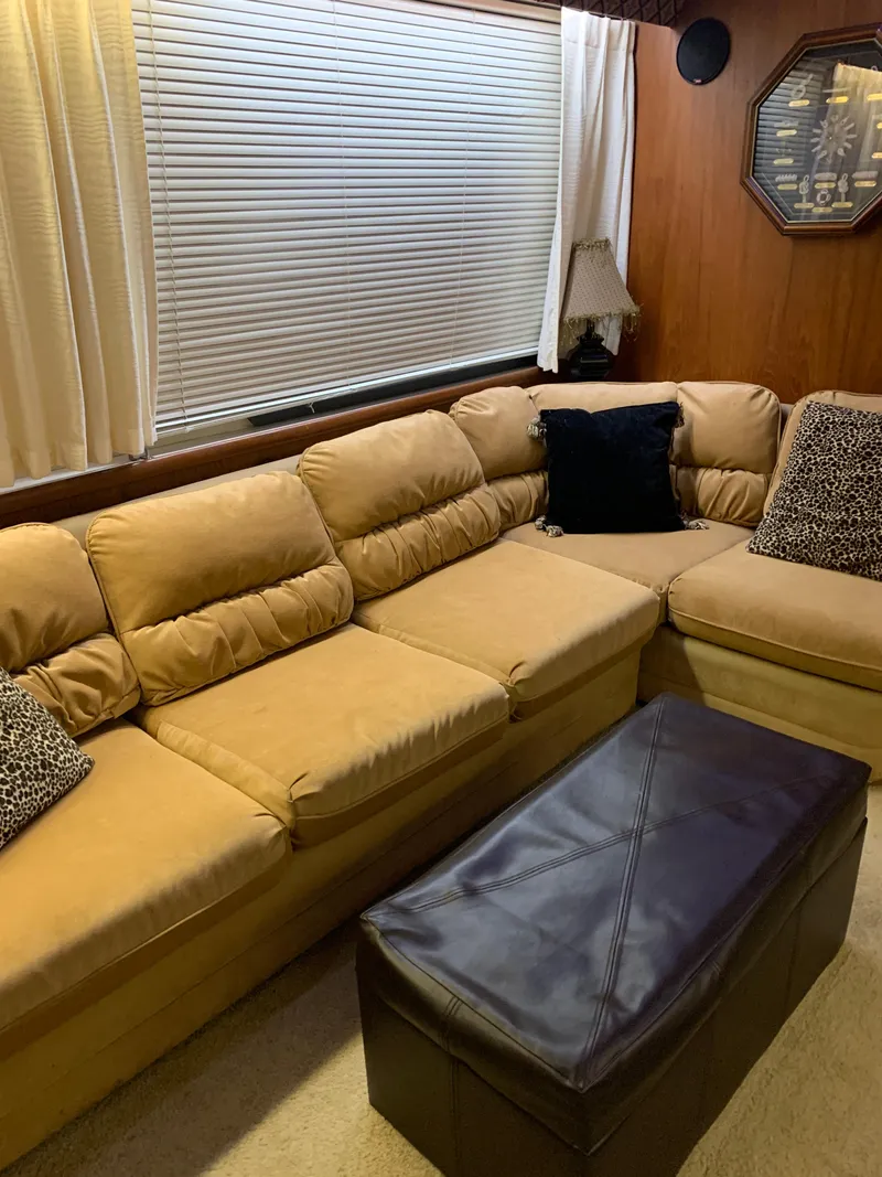 Slide: The Image of 1994 Carver 440 Aft Cabin Motor Yacht docked with power cables connected. - 12