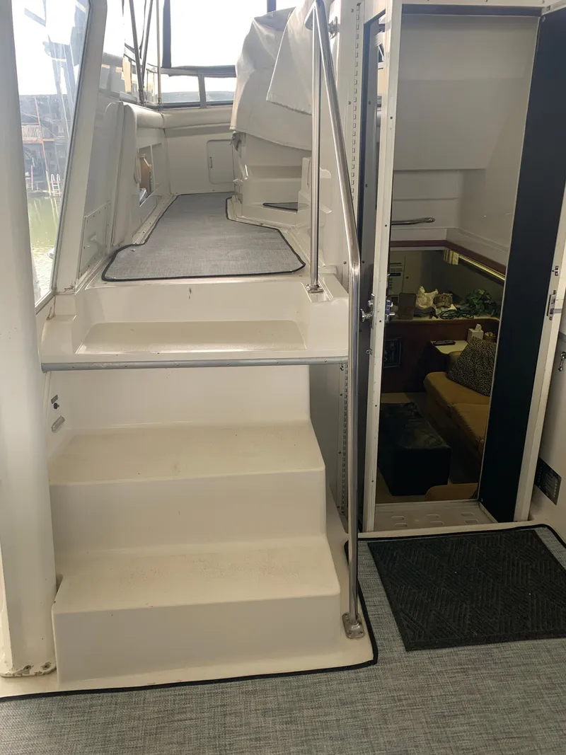 Slide: The Image of 1994 Carver 440 Aft Cabin Motor Yacht interior with stairs and cabin entrance. - 51
