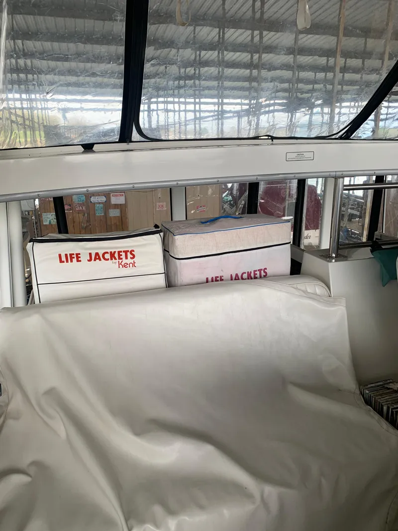 Slide: The Image of 1994 Carver 440 Aft Cabin Motor Yacht docked under a covered marina. - 7
