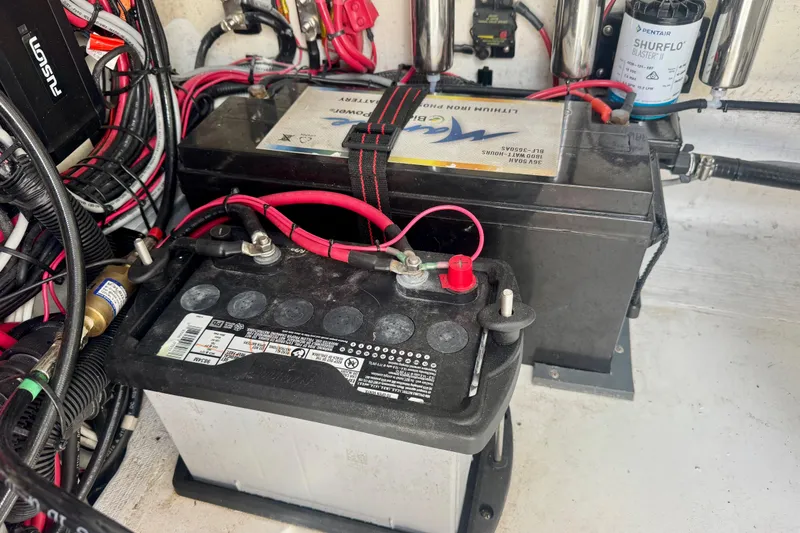 Slide: The Image of Battery setup in a 2023 ZCB Freemason 26 with wiring and components. - 14