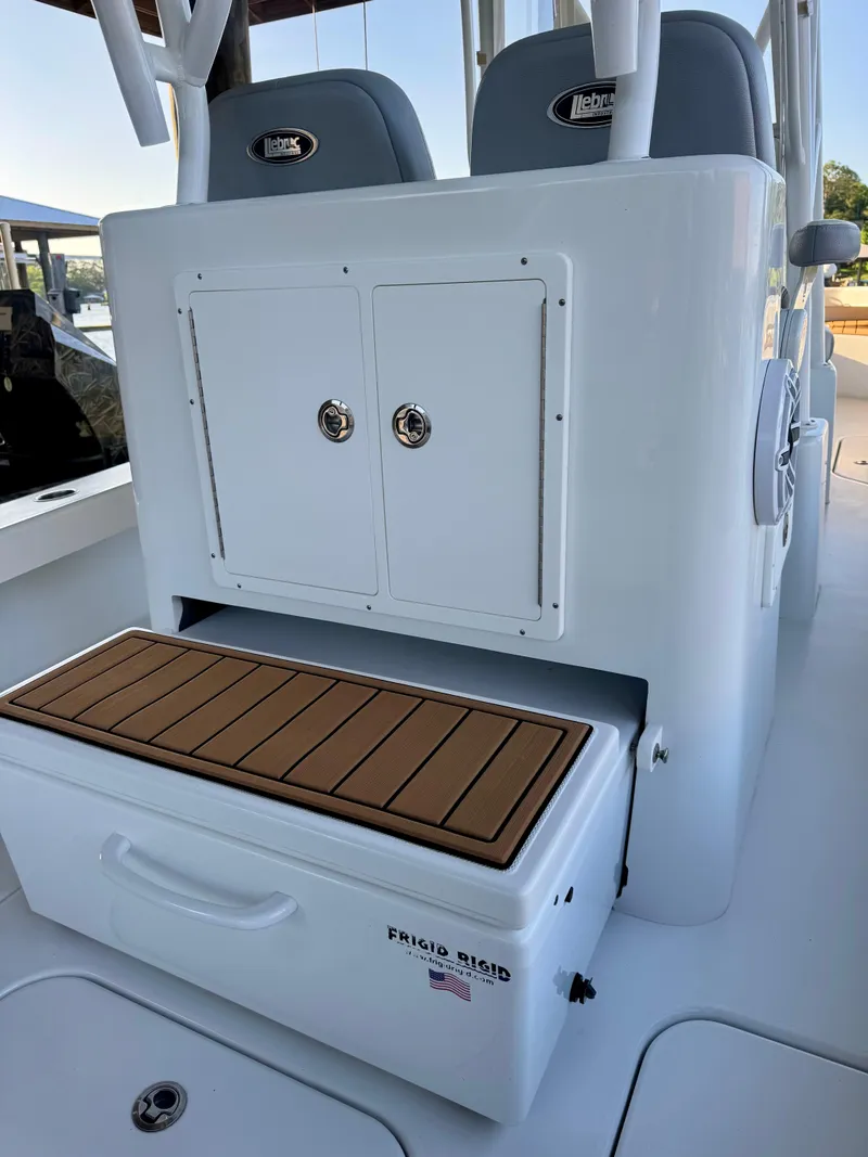 Slide: The Image of 2023 ZCB Freemason 26 boat interior with storage and seating area. - 8