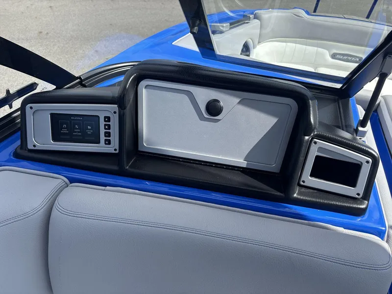 Slide: The Image of 2022 Supra SE 450 boat dashboard with control panel and seating. - 10