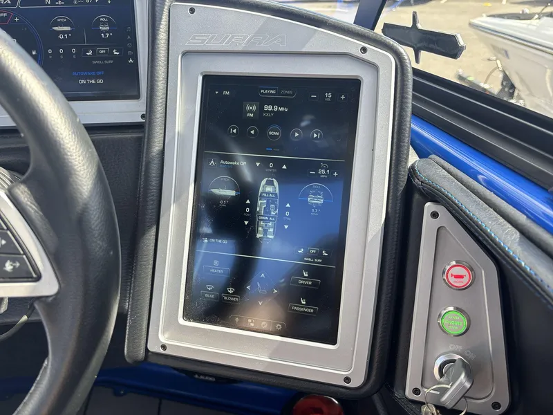 Slide: The Image of Touchscreen control panel in a 2022 Supra SE 450 boat cockpit. - 14
