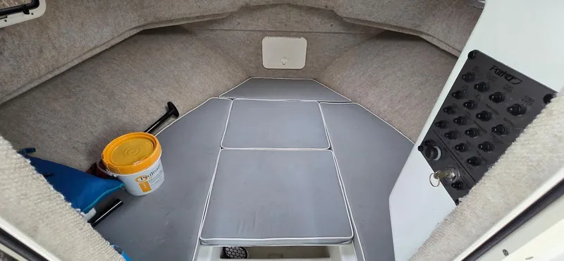 Slide: The Image of 2014 Parker 2520 XLD Sport Cabin interior with storage and seating. - 10