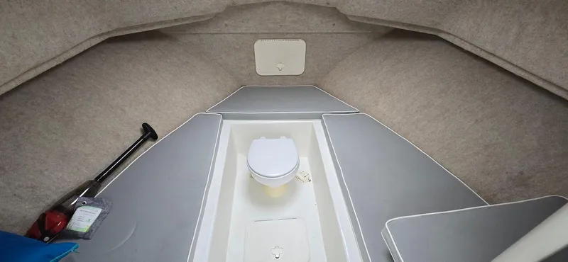 Slide: The Image of 2014 Parker 2520 XLD Sport Cabin interior with compact toilet and storage space. - 11