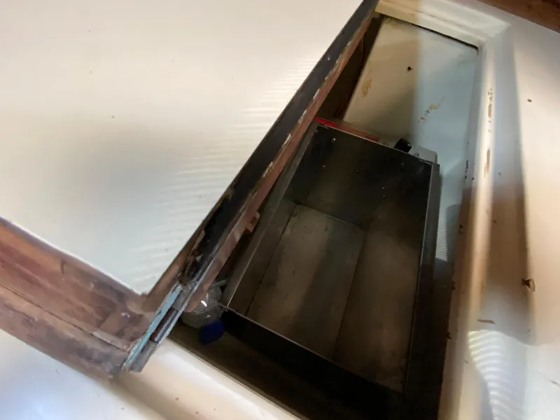 Slide: The Image of Open storage compartment on 1986 Pacific Seacraft Crealock 37 sailboat. - 16