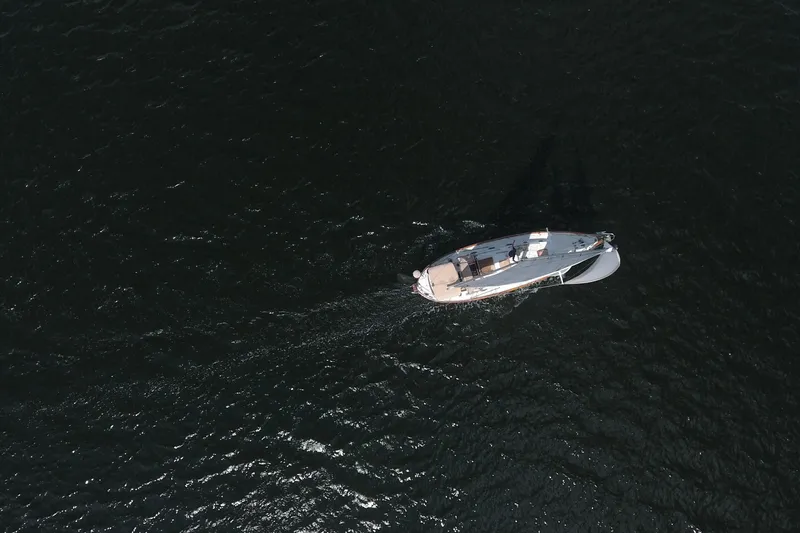 Slide: The Image of Aerial view of 1986 Pacific Seacraft Crealock 37 sailing on dark water. - 55