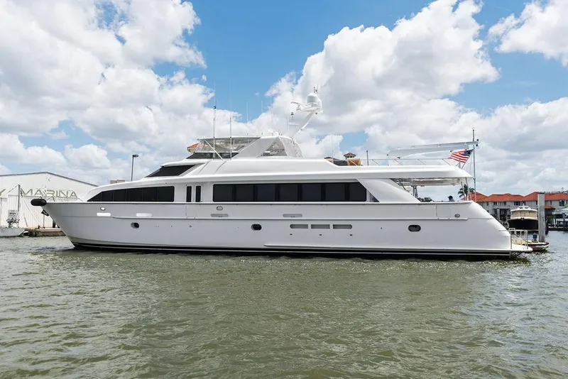 The Image of 2004 Hatteras 100 Motor Yacht on water under cloudy sky. - 0