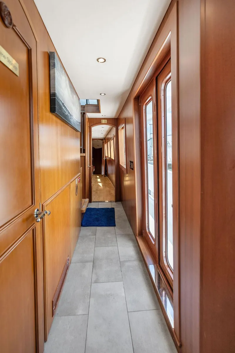 Slide: The Image of Luxurious wooden hallway interior of 2004 Hatteras 100 Motor Yacht. - 13