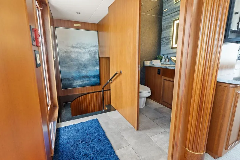 Slide: The Image of Luxurious interior of 2004 Hatteras 100 Motor Yacht with modern bathroom and staircase. - 16