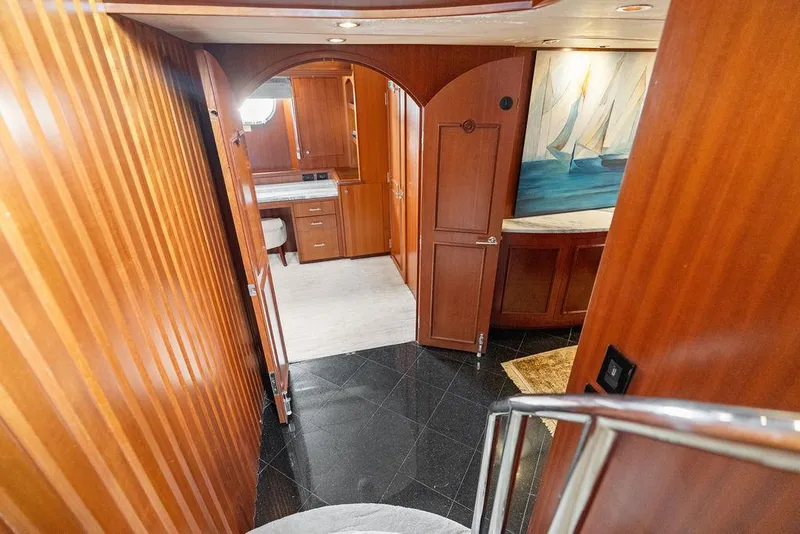 Slide: The Image of Luxurious interior of 2004 Hatteras 100 Motor Yacht with wood paneling and elegant decor. - 25