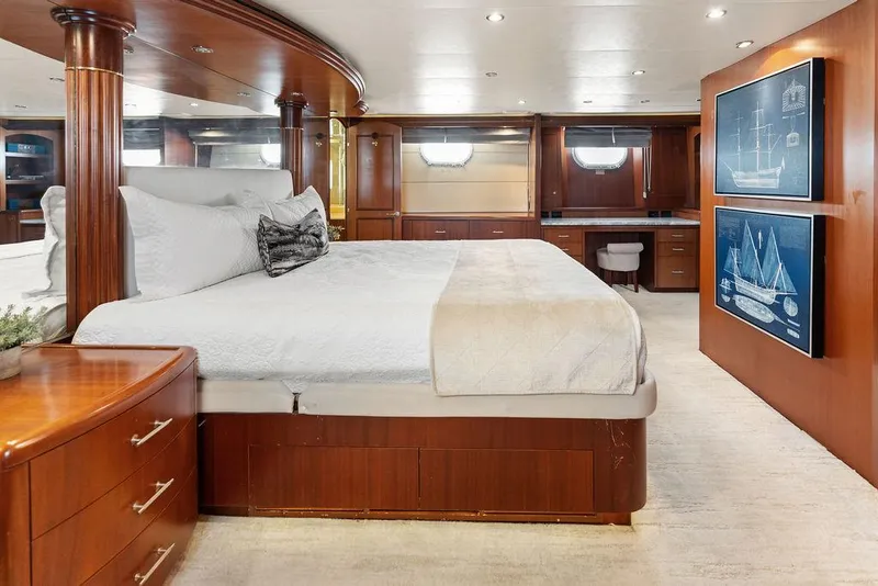 Slide: The Image of Luxurious bedroom interior of 2004 Hatteras 100 Motor Yacht with elegant wood finishes. - 28